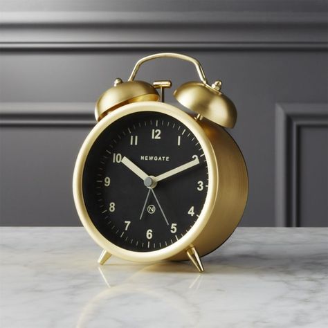 Shop charlie gold alarm clock.   Rise and shine with this modern take on an old-school wake up call.  Made in England by Newgate, brushed gold finish juxtaposes a black face with white numbers perched on two tiny angled legs. $29.95 Gold Alarm Clock, Black Gold Bedroom, Grand Room, Glamourous Bedroom, Bedroom Wall Clock, Gold Clock, Digital Wall Clock, Modern Luxury Bedroom, Simple Lifestyle