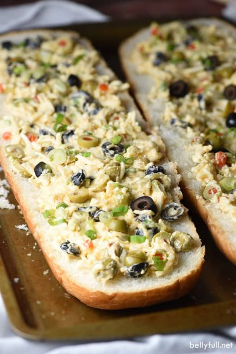 This Olive Cheese Bread is an easy and delicious appetizer with salty olives, gooey cheese, and crunchy bread. Crazy good! #olivebread #olivecheesebread Bread Hors D’oeuvres, Greek Olive Bread, Olive Bread Appetizer, Beach Bread Recipe, Olive Loaf Bread, Cheesy Olive Bread, Olive Cheese Bread Recipe, Olive Cheese Bread, Olive Bread Recipe