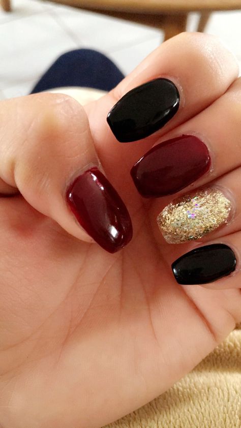 Burgundy black gold nails Burgundy Nails With Gold Short, Burgundy Black Gold Nails, Maroon Black And Silver Nails, Maroon Black And Gold Nails, Nails Red Black Gold, Burgundy Black And Gold Nails, Black Maroon Nails, Red And Black And Gold Nails, Black Burgundy Nails