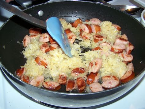 Stirring smoked sausage and kraut in a skillet Sour Kraut And Sausage, Sausage And Sour Kraut Recipes, Kraut And Weenies, Sausage And Kraut, Sour Kraut, Vienna Sausage, Polish Sausage, Weiners, Smoked Sausage