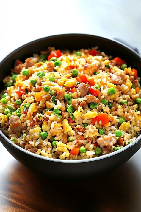 This Freakin' Fantastic Fried Rice recipe is a one-pan wonder that’s both delicious and simple! Perfect for meal prepping or a quick family dinner, this dish is filled with wholesome ingredients like eggs, fresh veggies, and seasoned rice. With a burst of garlic and soy flavor, it’s a fantastic way to turn leftover rice into a satisfying meal. Give it a try for restaurant-style fried rice at home! #OnePanMeal #FriedRiceLovers #EasyDinnerRecipes House Fried Rice Recipe Chinese Food, Fried Rice With Oyster Sauce, Easy Fried Rice With Egg, Egg Fried Rice Recipe Easy, Pan Fried Rice, Delicious Fried Rice, Best Fried Rice Recipe, Fried Rice At Home, Egg Fried Rice Recipe