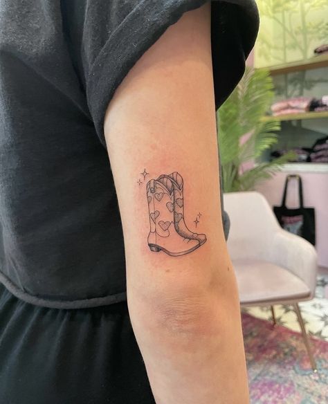 Cow Boy Boot Tattoos Simple, Girly Cowboy Boot Tattoo, Fineline Cowboy Hat Tattoo, Heart Cowboy Boot Tattoo, Pair Of Boots Tattoo, Cowgirl Boot Tattoo Small With Flowers, Pair Of Cowboy Boots Tattoo, Boot Tattoos For Women, Cowboy Boots Tattoo For Women