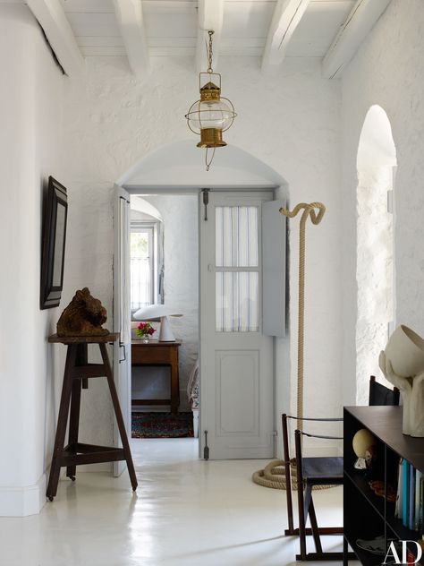 Visit a Globe-Trotting Designer’s Vacation Home in Greece | Architectural Digest Greek Homes, Greece Homes, White Hallway, Greek Decor, Mediterranean Living, Greek House, Foyer Decorating, Island House, Mediterranean Home