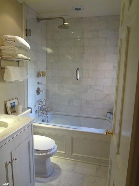 Partial glass door on tub/shower with drop in tub featuring marble top and wood wainscoting. #smallBathroom Bathroom Tub Shower Combo, Bathroom Tub Shower, Small Tub, Bathroom Tub, Tub Shower Combo, Trendy Bathroom, Small Bathroom Design, Bathroom Layout, Glass Shower Doors