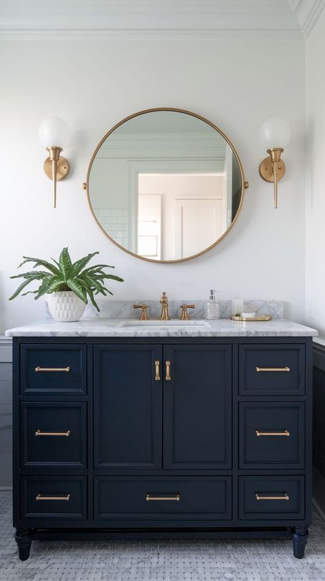 Explore elegant blue bathroom designs with bold tiles, beautiful vanities, and modern fixtures. Perfect for creating a calming, stylish, and functional space. Bathroom Color Vanity, Coastal Cottage Bathroom Ideas, Bathroom Navy Blue Vanity, Dark Blue Bathroom Cabinets, Small Navy Bathroom, Navy Blue Vanity Bathroom Ideas, Bathroom With Blue Vanity, Navy And Gold Bathroom, Navy Vanity Bathroom