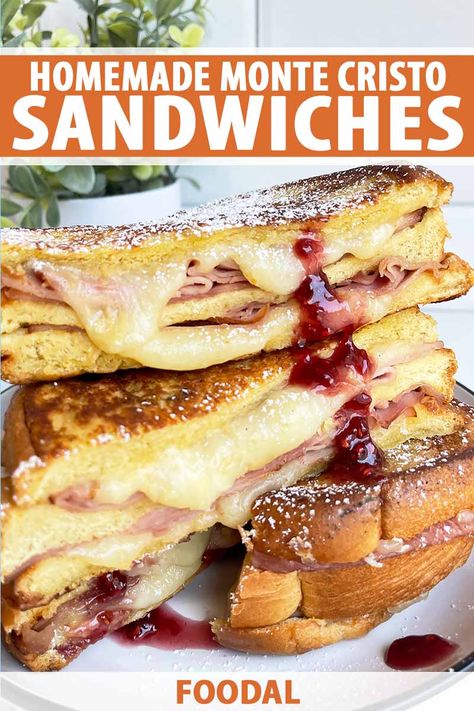 If a buttery triple-decker sandwich sounds like your cup of tea, you’ll fall hard for our melty Monte Cristo. After stacking ham and nutty Gruyère on puffy brioche, it's dipped in egg wash, griddled, dusted with powdered sugar, and served with sweet and tart raspberry jam. Read more. #montecristo #sandwich #foodal Montecristo Sandwich, Sandwiches Cold, Monte Cristo Sandwich Recipe, Easy Sandwich, Monte Cristo Sandwich, Best Sandwiches, Simple Sandwiches, Monte Cristo, Sandwiches For Lunch