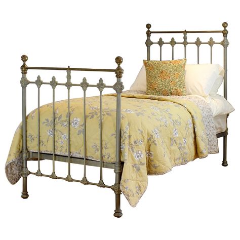 A traditional single Victorian brass and iron antique bed in hand-painted faded gold, with tarnished brass top rail, brass collars and round knobs. This fine original antique bed from the late Victorian era has attractive castings, which have been accentuated by the hand-paint finish, and original aged brass. The brass does show signs of age in places with dents but we think these add to the character of the piece. This bed takes a standard UK single 3ft wide x 6ft 3in long base and mattress, bu Vintage Twin Bed, Victorian Era Bedroom, 1920s Bed, Vintage Metal Bed Frame, Brass Bed Frame Antique, Antique Single Beds, 1930 Bed, Victorian Beds, Antique Baby Brass Beds