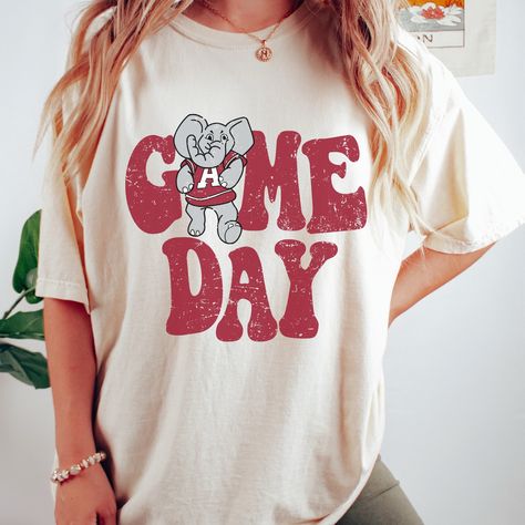 New product- Vintage Alabama Crimson Tide Game Day Shirt! Get ready to show off your Roll Tide pride with our Vintage Alabama Shirt, a must-have for all fans! This unique design combines a vintage style with the fierce spirit of Crimson Tide, creating a shirt that stands out from the crowd. Each shirt is meticulously printed by me using high-quality materials on a Comfort Colors shirt, known for its exceptional comfort and durability. Whether you're cheering on the crimson tide at the stadium or High School Football Shirts Design, High School Football Shirts, Alabama Game Day, Alabama Shirt, Htv Shirts, Alumni Events, Alabama Shirts, Football Shirt Designs, School Designs