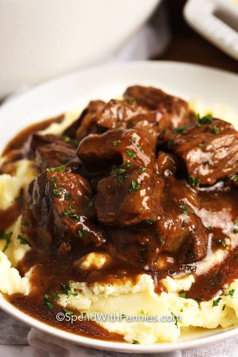 This Beef Tips & Gravy recipe so is easy! Simmered on the stovetop until tender, then served with mashed potatoes and veggies. #spendwithpennies #beeftipsandgravy #maindish #beeftips #recipe #gravy Beef Stew With Mashed Potatoes Recipe, Slow Cooker Stew Beef And Gravy, Beef Steak With Gravy, Beef Stew Meat And Gravy Crockpot, Roast Tips Recipe, Magnolia Table Beef Tips, Beer Tips And Gravy, Fast Beef Tips And Gravy, Beef Stew And Gravy