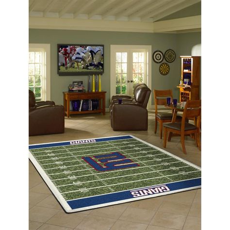 Show your team spirit with this 4 x 6' officially licensed New York Giants area rug, styled to resemble a football field! Made with premium stain master® nylon fiber, this rug is fade resistant, durable and easy to care for. Endura-Loc™ high performance backing helps assure the rug always lies flat and serged edges give your rug the quality that your home and team deserve. The rug has a 2 year warranty that protects against manufacturer's defects. Product made in the USA. Imperial International Football Rug, Living Room Area Rugs, Jacksonville Jaguars, Arizona Cardinals, Rug Floor, Indianapolis Colts, Buffalo Bills, Detroit Lions, Minnesota Vikings