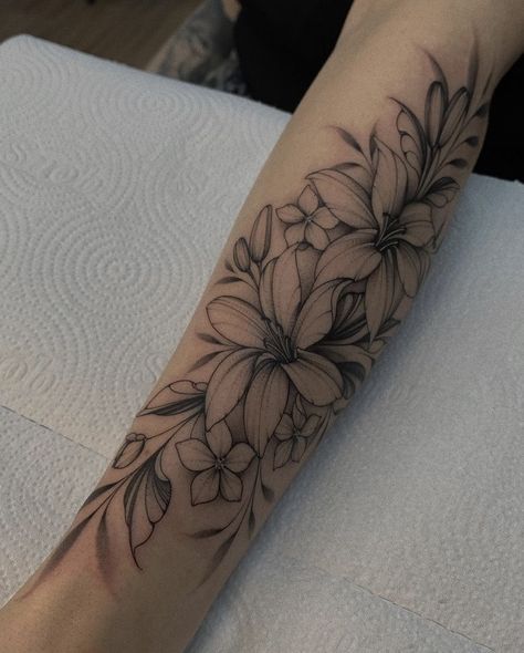 Flower Tattoos Sleeve Forearm, Floral Mandala Leg Sleeve, Floral Angel Tattoo, Tattoo Flower With Words, Tattoos That Arent Flowers, Lily Half Sleeve Tattoo For Women, Lilly Arm Tattoos For Women, Water Lily Arm Tattoo, Flower Tattoos For Arm