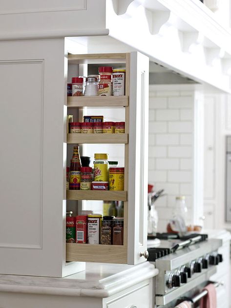 Pullouts to the side of the cooktop provide storage for spices and cooking oils. Kitchen Storage Ideas, Driven By Decor, Small Kitchen Storage, Kitchen Hacks Organization, Spice Storage, Kitchen Cabinet Storage, Storage Design, Favorite Kitchen, Kitchen Remodel Idea