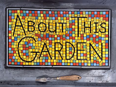 Mounting and Grouting Mosaic Garden Sign | How To Mosaic Blog Grouting Mosaics, Landscaping Blocks, Black Grout, Art Supply Stores, Metal Tools, Mosaic Garden, Garden Signs, Glass Mosaic, Grout