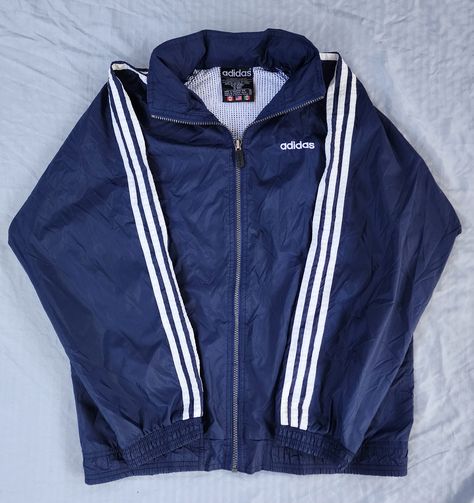 Vintage 1990s Adidas Blue White Windbreaker  In great condition  9.5/10 XL tag Fits a Small 26 x 23 Pit to Pit Any questions feel free to reach out! Cheap Navy Adidas Tops, Vintage Blue Windbreaker For Fall, Adidas Blue Sporty Windbreaker, Blue Retro Windbreaker For Streetwear, Adidas Streetwear, 90s Tracksuit, Adidas Vintage Jacket, 90s Lookbook, Cheap Vintage Blue Windbreaker