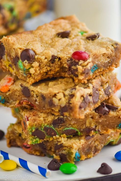 Monster Cookie Bars are so easy to make, and full of delicious flavor. Such a fun treat to bake with the kiddos! Monster Bars Recipe, Sheet Pan Bars, Pan Bars, Monster Cookie Bars Recipe, Monster Bar, Monster Cookie Bars, Monster Cookie, Jelly Roll Pan, Bars Recipe