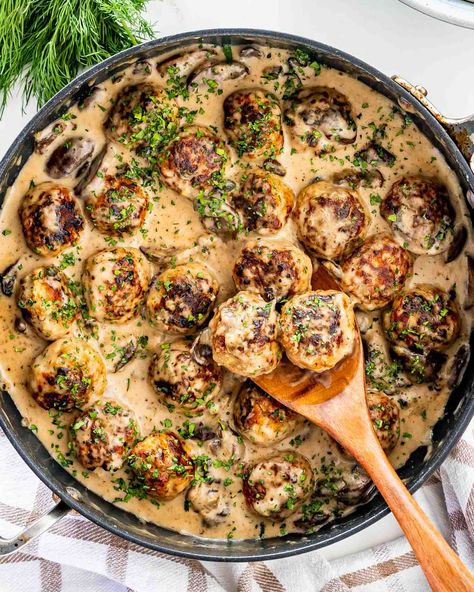 Meatballs with Mushroom Gravy - pork meatballs in a delicious creamy mushroom sauce served over mashed potatoes. #meatballs #mushrooms #recipe #gravy Mushroom Gravy For Meatballs, Meatball Mushroom Sauce, Meatballs In Creamy Mushroom Sauce, Creamy Mushroom Meatloaf, Mushroom Sauce Meatballs, Meatball Mushroom Recipes, Mushroom Gravy Meatballs, Meatball And Mushroom Recipes, Meatballs Mushroom Gravy