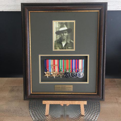 Framing war medals is a very honourable and important responsibility. In addition to displaying the medals proudly in your home, it is very important to treat these heirlooms with the utmost respect. It is crucial to protect them with a ... Medal Display Ideas, Medal Display Case, Patches Display, Portfolio Pictures, Trophy Display, Military Memorabilia, Display Frames, Hinged Frame, Military Medals