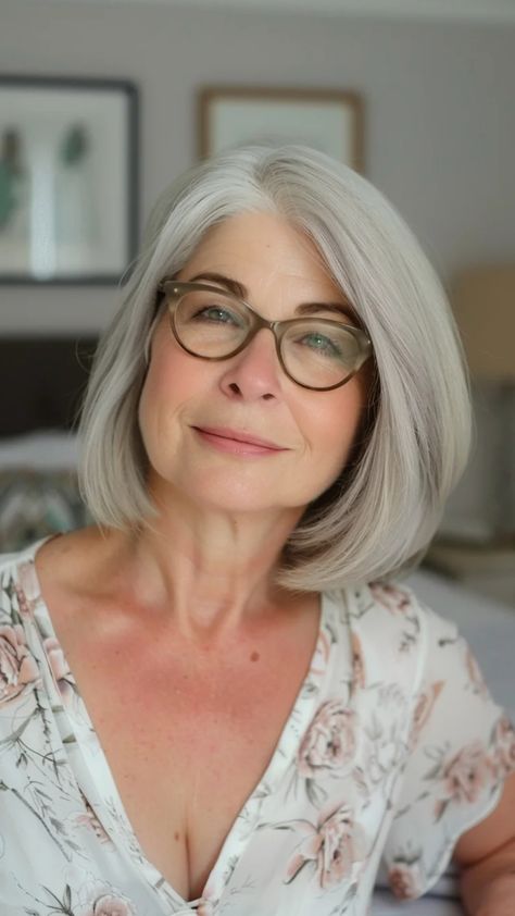 Woman with gray hair and glasses smiling softly, wearing a floral blouse. Short Bobs For Fine Hair, Short To Medium Haircuts, Bobs For Fine Hair, Grey Bob Hairstyles, Short Hairstyles Over 50, Gray Hairstyles, Medium Short Haircuts, Grey Hair Over 50, Grey Bob