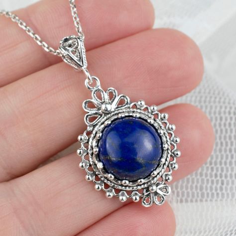 ⭐ Embrace elegance with a touch of celestial charm! Our Lapis Lazuli Gemstone 925 Sterling Silver Pendant is more than just jewelry; it's a statement of style and sophistication. ✨ Uniquely handcrafted to perfection, this solid silver charm will be the blue jewel of your collection. 💙 Perfect for gift-giving or treating yourself to something special. Ready to own this piece of the sky? Click the link to adorn your neckline with this handmade treasure! ➡️ https://nuel.ink/scAmQ8 #LapisLazuliL... Boho Pendant Necklace, Blue Stone Pendant, Floral Pendant Necklace, Lapis Lazuli Gemstone, Necklace Chain Lengths, Boho Pendant, Floral Pendant, Art Pendant, Sterling Silver Filigree