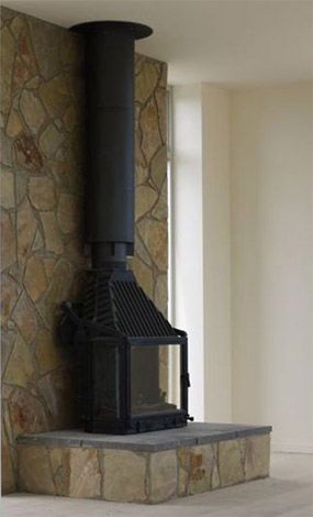 Radiante_700_3V Freestanding Fireplace Stone Wall, Freestanding Fireplace Stone, Chiminees Phillipe, Fireplace Limestone, Architectural Design Concept, Wood Burning Stove Corner, Retractable Glass Doors, Stone Veneer Wall, House Fireplace