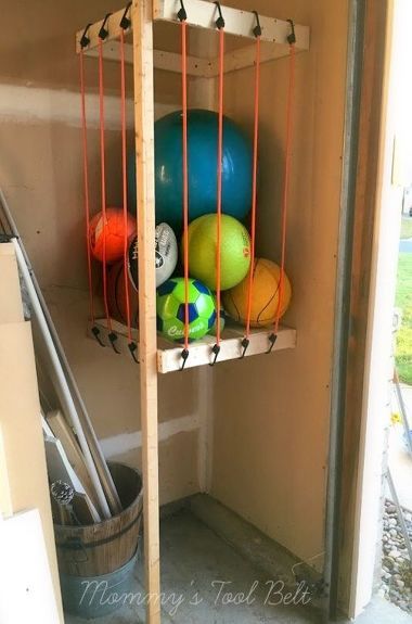 s the newest diy space saving storage ideas to keep your home organized, Garage Ball Storage Diy Declutter, Bike Storage Garage, Diy Space Saving, Diy Organizer, Bike Room, Small Garage, Diy Space, Garage Storage Systems, Ball Storage