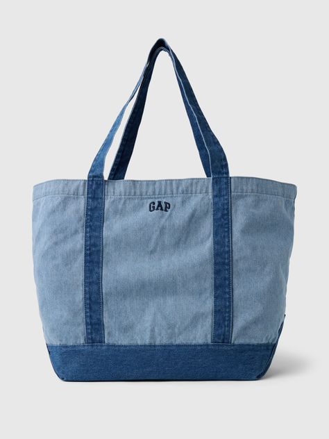 Soft cotton denim tote bag.  Shoulder straps at top.  Inner pocket with zipper.  Embroidered mini Gap arch logo at front.  Responsibly Made: This denim bag s is part of our water-saving Washwell program.  Compared with conventional wash methods, Washwell uses at least 20% less water and has saved over a billion liters of water since 2016.  This product was made in a factory that invests in gender equality and women’s empowerment.  Through RISE Reimagining Industry to Support Equality) and Gap In Tote Bag With Pins, Tote Bags With Zipper, Trendy Bags, Knitting Tote Bag, Gap Logo, Arch Logo, Jean Crafts, Denim Tote Bags, Denim Tote