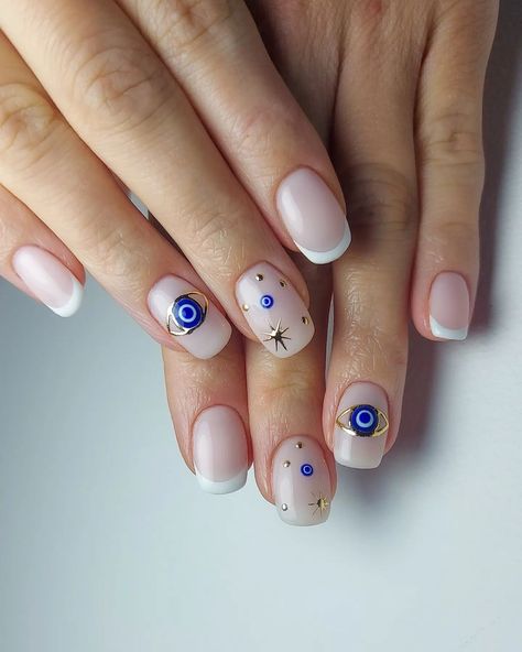 Discover 22 captivating Evil Eye nail designs! Dive into this trending nail art and learn how to DIY for a touch of mystique and style. Unveil your inner enchantress! Click the article link for more photos and inspiration like this // Photo Credit: Instagram @jark.nails // #acrylicnails #acrylicnailsstyles #bestnailstyles #elegantnails #evileyemanicure #evileyenail #evileyenaildesigns #evileyenailideas Evil Eye Manicure Short Nails, Evil Eye Nails Design Short, Spiritual Nails Designs Short, Evil Eye Short Nail Designs, Evil Eye Square Nails, Hamsa Nail Art, Greek Eye Nail Art, Evil Eye Nail Art Design, Evil Eye Acrylics