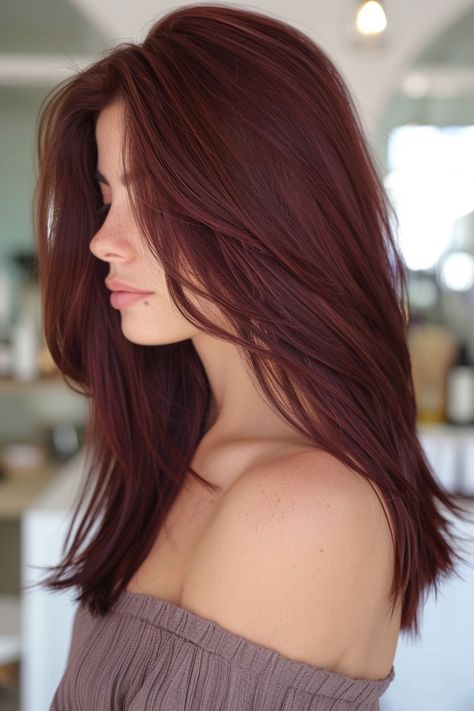 Woman with long, straight maroon hair in an off-shoulder top. Medium Cherry Brown Hair, Red Chestnut Hair Color, Red Mahogany Hair Color, Dark Cherry Red Hair With Highlights Chocolate Brown, Dark Red Cherry Hair, Dark Cherry Brown Hair Chocolates, Chocolate Cherry Ombre Hair, Mahogany Hair Color, Cherry Cholocate Hair