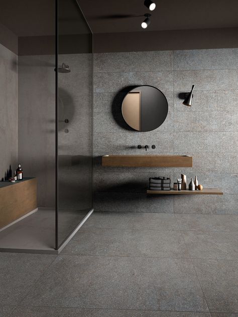 Native is inspired by the primordial appeal of porphyry quarried from the mountains of Italy’s Trentino region. It is an agglomerate-effect stone with an unusual colour that stands out for its subtle, homogeneous texture. Beige And Black Bathroom, Cement Bathroom Floor, Design Interior Baie, Cement Bathroom, Granite Bathroom, Grey Bathroom Tiles, Luxury Bathroom Master Baths, Bad Inspiration, Beige Bathroom