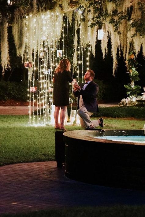 24 Best Proposal Ideas For Unforgettable Moment ❤️ best proposal ideas fairy tale night time proposal ideas with lights on trees near fountain ❤️ See more: https://ohsoperfectproposal.com/best-proposal-ideas/ #bridalsets #diamondrings #weddingringsforwomen #proposalideas #ohsoperfectproposal Romantic Outdoor Proposal Ideas, Night Proposal Ideas, Backyard Proposal Ideas Night, Best Proposal Ideas, Outdoor Proposal, Unique Proposals, Proposal Pictures, Wedding Alters, Best Proposals