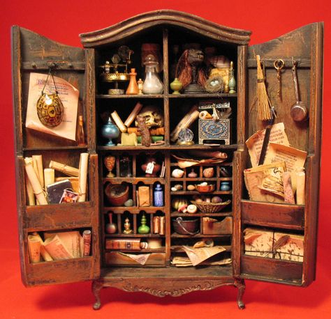 Wizard's Potion Cabinet.  1:12 scale. In a private collection.   By IGMA Fellow Patricia Paul Cabinet Of Curiosities Miniature, Potions Cabinet, Miniature Cabinets, Potion Cabinet, Harry Potter Miniatures, Haunted Dollhouse, Halloween Miniatures, Witch House, Curio Cabinet