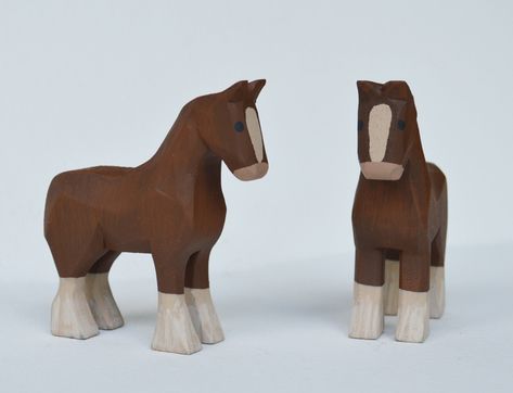 "A pair of Hand carved wooden Clydesdale Horse made from bass wood, hand painted with acrylic paints. Measurements are approximately 3\" inches long, 1\" wide and 3 1/4\" high *Animals are sold by the pair. Message me if you would like to purchase just one, I would be happy to set up a custom listing for you. Mo and Kelly Dallas have been making a living producing Hand Carved wooden Noah's Arks, Angels & other folk art in our home studio in rural Ohio for over 20 years. All of our products are h Toys Made Out Of Wood, Wooden Figurines Handmade, Hand Carved Wooden Toys, Hand Carved Wooden Animals, Wooden Animals Patterns, Whittled Animals, Whittling Patterns Beginner, Easy Whittling Projects, Horse Wood Carving