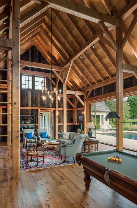 Archer & Buchanan Architecture | Heavy timber framed party barn with large folding doors opening up to pool and patio with bar, billiards, game area and sitting area. #timberframe #partybarn #poolhouse #worthingtonshagenbuilders #tammyconnorinteriordesign #tomcranephotography Party Barn Ideas, Barn Pool House, Barn Pool, Pool House Ideas, House Mediterranean, Barn Conversions, Pool House Plans, Stone Farmhouse, Camping Kitchen