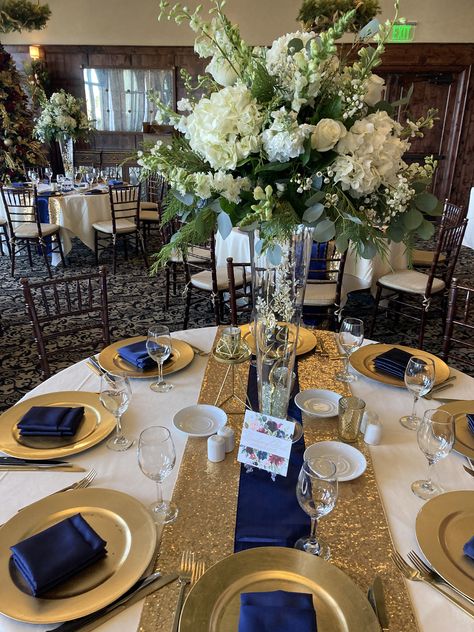 Wedding Decorations Navy Blue And Gold, Gold And Royal Blue Centerpieces, Navy Blue White And Gold Wedding Centerpieces, Royal Blue Theme Quinceanera Tables, Navy Blue Gold And White Wedding Receptions, Navy Blue Gold Party Decorations, Navy Blue Table Decorations, Sapphire Blue And Gold Wedding, Navy Blue Quinceanera Centerpieces