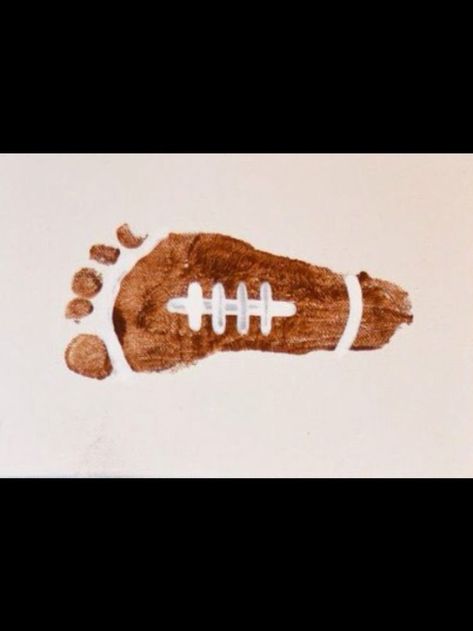 Football Footprint Baby Footprint Art Fall, Skeleton Footprint Art, Football Infant Art, Brown Crafts For Toddlers, Fall Foot Print Crafts, Fall Hand And Foot Print Crafts, Fall Baby Footprint Art, Fall Baby Art Projects Infants, Fall Crafts Infants