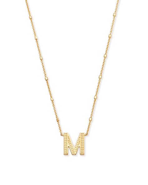 No need to spell it out...The Letter M Pendant Necklace in Gold is sure to be a new favorite. Featuring your initial, or your bestie's, or your crush's (we won't tell), wear a personalized reminder designed with our signature etched detail. Metal 14k Yellow Gold Over Brass Size 19" chain, 0.69"L X 0.6"W pendant Closure Lobster clasp with single adjustable sliding bead Please note: Due to the one-of-a-kind nature of the medium, exact colors and patterns may vary slightly from the image shown. | K M Letter Necklace, Letter A Pendant, Wishlist 2022, The Letter M, M Necklace, Beautiful Gold Necklaces, Birthday Bracelet, Kendra Scott Necklace, Bottle Charms