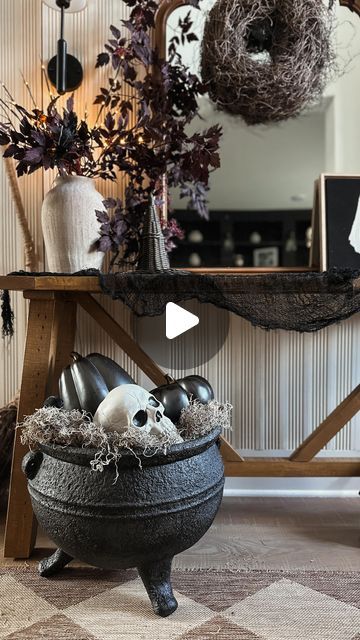 Alexis Gonzalez on Instagram: "Comment SHOP for links! How spooky awesome did this huge cauldron turn out! I love it so much! The cauldron is so big.. I still can’t get over how big it is! My entryway is just about finished I can’t wait to show y’all all of it real soon! 
I stuffed the giant cauldron with paper first because it is so deep and I added moss on top of it. I found the prettiest black pumpkins so I added those along with a crow, and skeleton skull and I love how it turned out!

#spookyseason #houstonhomes #halloweeniscoming #halloweendecor #entrywaydesign #modernfarmhouse #modernfarmhousestyle #hyggehome #pumpkinseason #spookydecor #targetdecor" Giant Cauldron, Cauldron Planter, Black Pumpkins, Cast Iron Cauldron, Iron Cauldron, Target Decor, The Cauldron, A Crow, So Deep