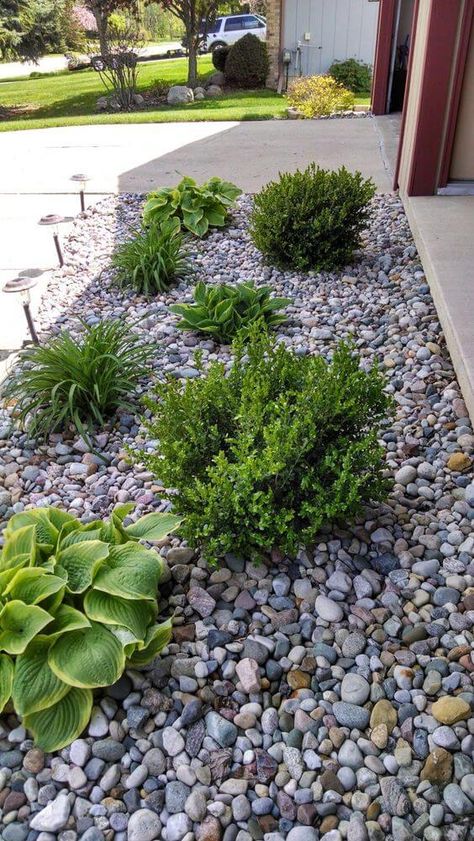 39 Attractive Low-maintenance Gardens For Your Landscaping Simple Landscaping Front Yard Low Maintenance With Rocks, Low Maintenance Driveway Landscaping, River Rock Front Yard, River Rock Around House Foundation, Low Matienence Landscaping, Low Maintenance Landscaping Front Yard Full Sun, Rock Side Yard, Low Maintenance Landscape Ideas Front Yard Stones Rock Border, Rocks In Front Of House