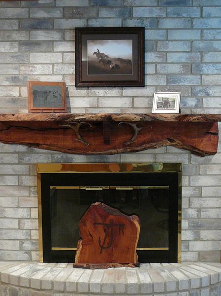 Nave's Sawmill & Woodworks is a husband and wife team that specalizes in Mesquite wood. - Fireplace Mantles Wooden Mantle Fireplace Rustic, Fireplace Live Edge Mantle, Raw Wood Mantle, Live Edge Mantel Ideas Fireplace, Wrap Around Mantle Fireplace, Live Edge Mantel Ideas, Mantel Ideas Fireplace, Fireplace Pergola, Live Edge Fireplace Mantel