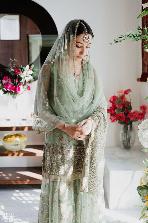 Photo of A coy bride to be at her roka ceremony, dressed in a pastel green sharara भारतीय दुल्हन संबंधी, Green Sharara, Sangeet Outfit, Ceremony Dresses, Green Gown, Pakistani Wedding Dresses, Pakistani Bridal Wear, Engagement Dresses, Pakistani Bridal