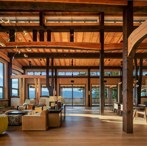 Experience how timber framing creates warm, inviting living rooms that connect to nature. Luxury lakefront custom mountain home. Warm Inviting Living Rooms, Timber Frame Living Room, Connect To Nature, Frame Living Room, Nature Luxury, Moss Covered, Ancient Forest, Timber Framing, The Calm