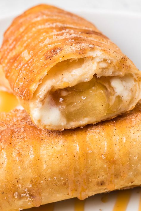 Deep-fried caramel apple cheesecake chimichangas. Dessert Chimichanga Recipe, Cheesecake Chimichangas, Deep Fried Desserts, Fried Cheesecake, Chimichanga Recipe, Fried Dessert, Canned Apple Pie Filling, Caramel Apple Cheesecake, Apple Cheesecake