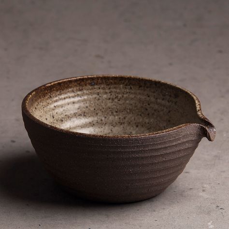 Discover the authentic essence of the Japanese tea ceremony with our handcrafted coarse pottery Matcha Bowl. Each piece, unique in its rustic elegance, is designed to elevate your matcha experience. The textured, earthy brown glaze and the distinctive spout for easy pouring capture the wabi-sabi philosophy, celebrating beauty in imperfection. Ideal for dry scooping or sharing tea, this chawan is not just a bowl, but a piece of art that connects you to the centuries-old tradition of matcha. #... Wabi Sabi Philosophy, Beauty In Imperfection, Matcha Set, Bamboo Tea, Rustic Ceramics, Earthy Brown, Japanese Tea Ceremony, Matcha Bowl, Tea Bowl