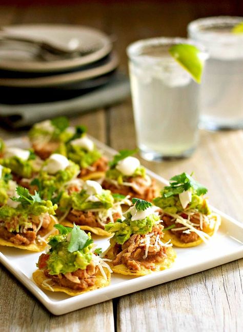 25 of the Most Delicious Super Bowl Food Ideas, According to Pinterest | Brit + Co Party Food Easy, Chicken Tostadas, Healthy Superbowl Snacks, Mexican Appetizers, Food Appetizers, Easy Mexican, Super Bowl Food, Healthy Appetizers, Refried Beans