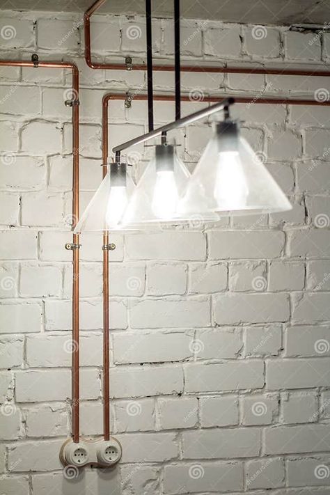 A Vintage Outlet and Electrical Wiring in a Copper Tube. Stock Image - Image of copper, closeup: 109117261 Conduit Lighting, Old Home Renovation, Eclectic Industrial, Copper Tube, Industrial Wall Lights, Beach Cottage Decor, Copper Tubing, Home Office Setup, Electrical Wiring