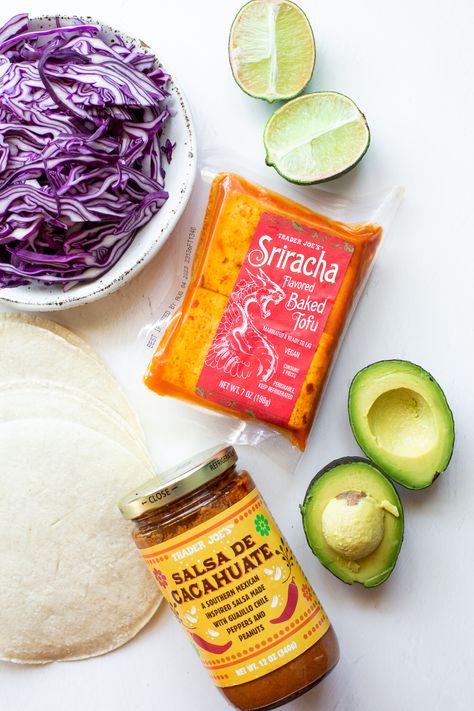 These Sriracha Tofu Tacos use Trader Joe's Baked Sriracha Tofu for a quick vegan meal! The tofu is quickly sautéed and piled onto corn tortillas with cabbage, avocado, and salsa for a deliciously filling high-protein plant-based dinner. Ready in 15 minutes! Trader Joe’s Sriracha Tofu, Sriracha Tofu Recipes Trader Joes, Sriracha Tofu, Tofu Tacos, Quick Vegan, Quick Vegan Meals, Trader Joes Recipes, Plant Based Dinner, Avocado Slices