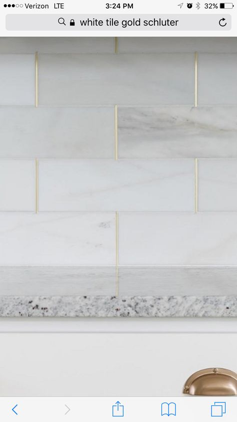 Kitchen backsplash, marble w/gold schluter strips! White Tiles Gold Grout Kitchen, White Tiles With Gold Grout, Cream And Gold Backsplash, White Gold Kitchen Backsplash, Gold Grout Backsplash, Fixer Upper Kitchen Backsplash, Gold Tiles Kitchen, Kitchen Backsplash Marble, Gold Grout