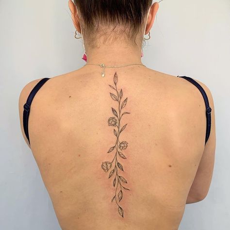 back tattoo Small Tattoo On Spine For Women, Back Tattoo Women Spine Traditional, Flower And Vine Spine Tattoo, Back Tattooed Woman, Flower Spine Tattoos Simple, Middle Of Spine Tattoo, Fine Like Back Tattoo, Vine On Spine Tattoo, Flowers Down Back Tattoo