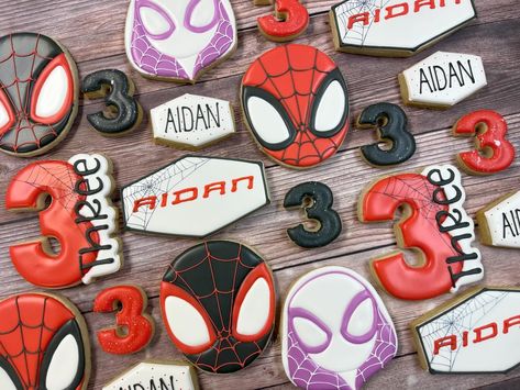 Spidey and his amazing friends birthday for Aidan! #spideyandhisamazingfriends #marvelcookies #paradisesugarshoppe #buzzfeedfood #royalicingcookies #sugarcookies #decoratedcookies #roc #ny #rocny #roceats #rocfoodies #rochesterfoodies #rochesterfood #rochesterny #rochesternybakery #rocfood #bestcookiesever #customcookies #royalicing #cookies #cookieart #cookiesofinstagram Spider Verse Cookies, Spiderman And His Amazing Friends Birthday Cake, Spidey And Friends Cookies, Spidey And His Amazing Friends Cupcakes, Spidey And His Amazing Friends Cookies, Spidey And His Amazing Friends Birthday, Friends Cookies, Spidey Party, Spidey Birthday