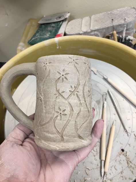 Greenware with hand carved flowers. Clay Pot Carving Designs, Pottery Carving Ideas Simple, Mug Carving Ideas, Pottery Carving Ideas Patterns, Ceramic Flower Carving, Ceramic Mug Carving, Sgraffito Designs Easy, Ceramic Pitchers Ideas Handmade Pottery, Flower Carving Clay